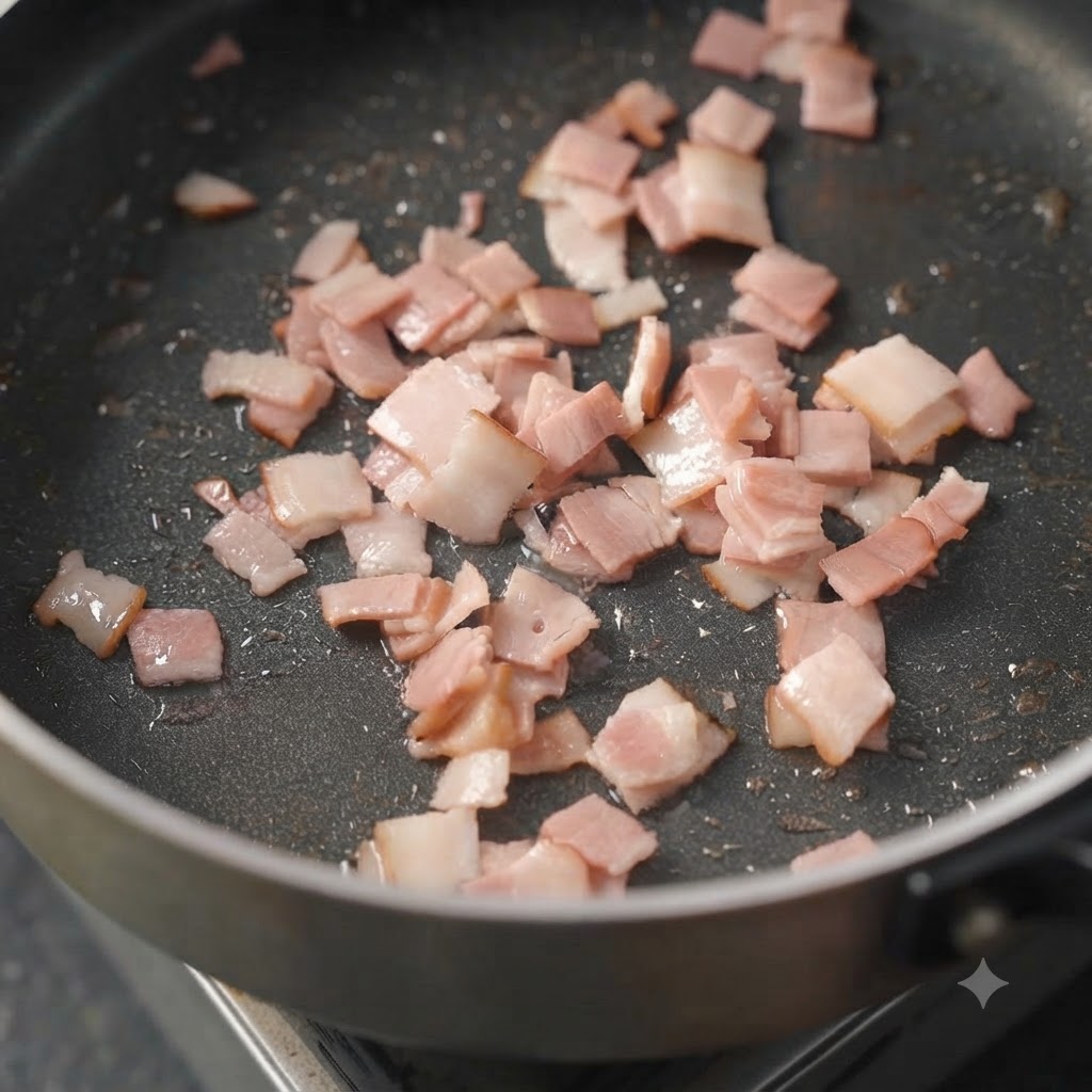 スキレットの中で、緑のセロリとオレンジの人参のキューブが炒められている様子。